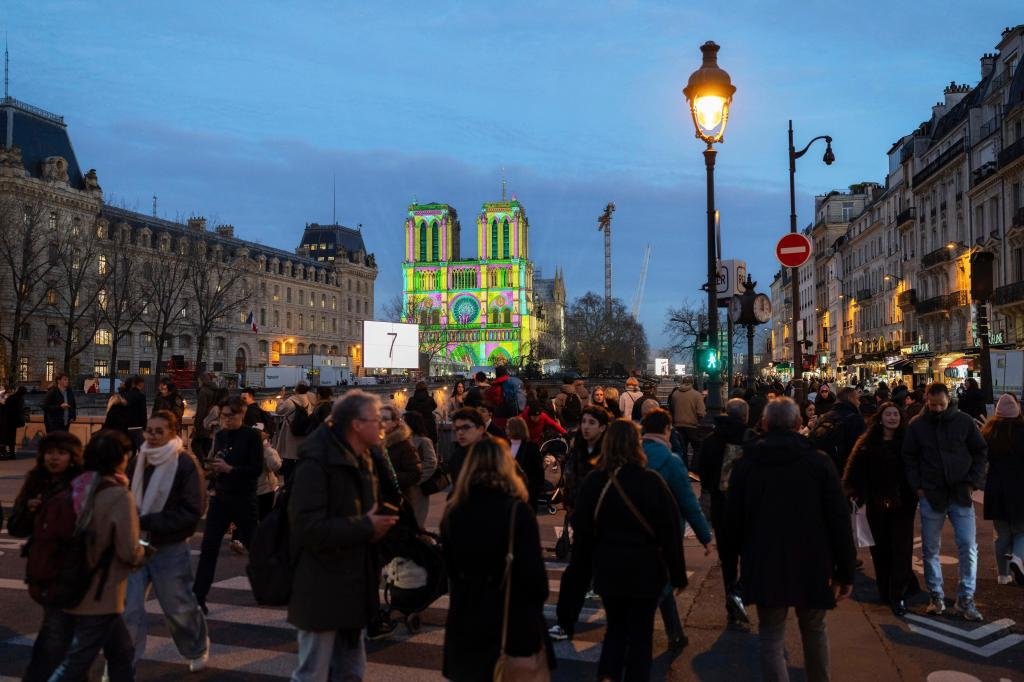 The Latest: The famed Notre Dame Cathedral in Paris reopens to great fanfare